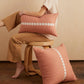 cowrie embroidered pillow in sandalwood