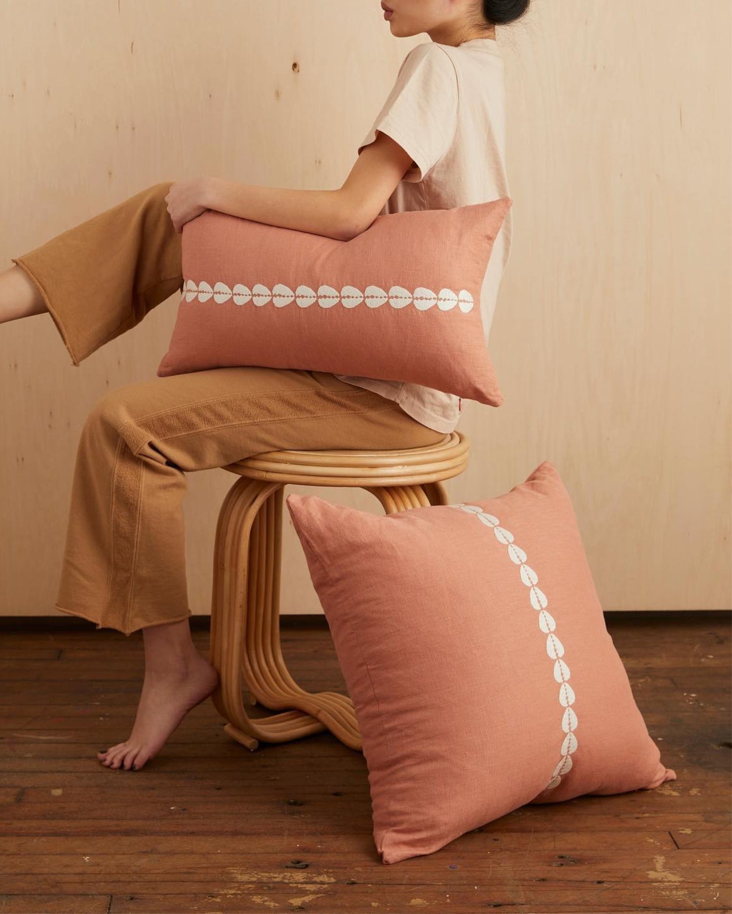 cowrie embroidered pillow in sandalwood