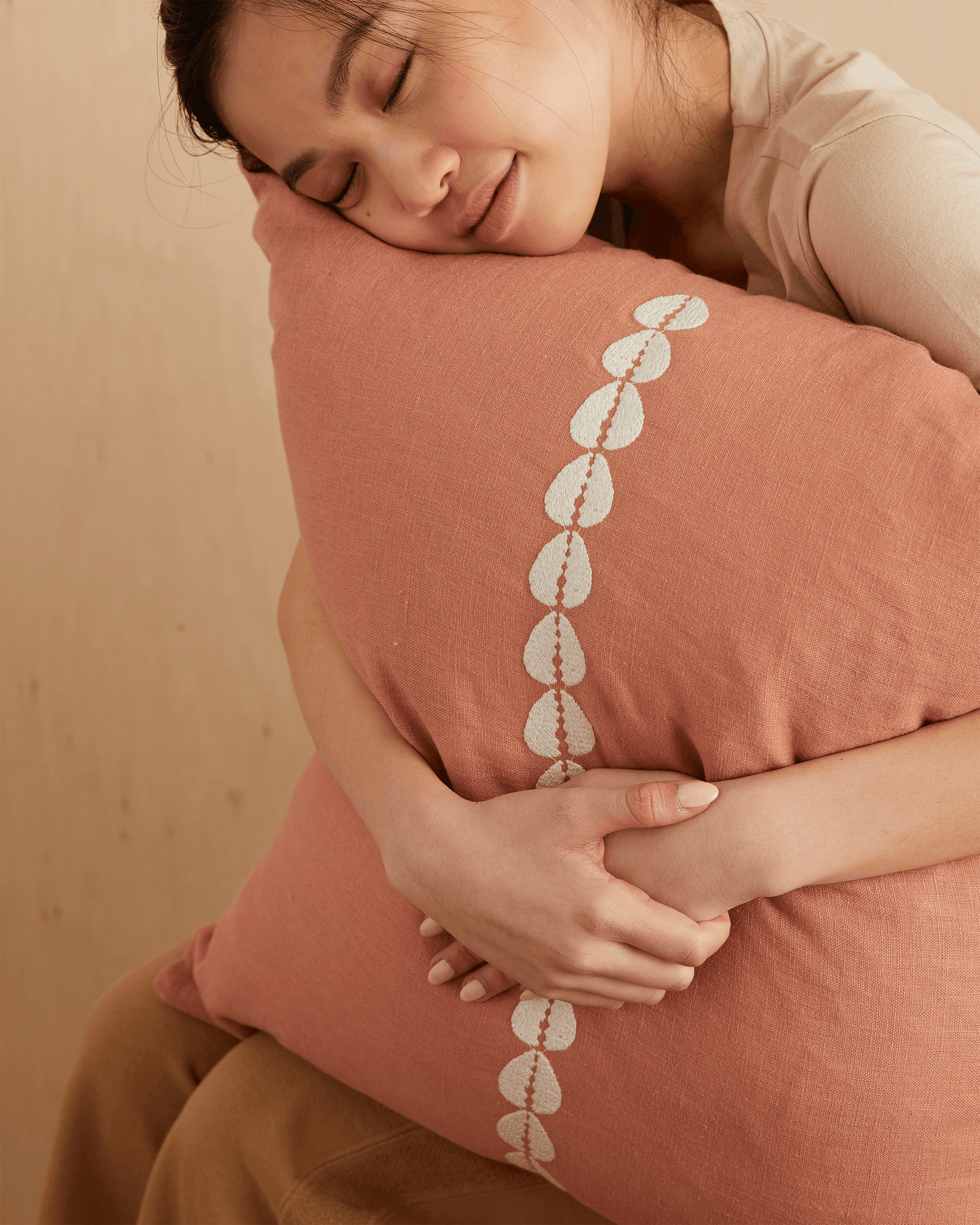 cowrie embroidered pillow in sandalwood - PILLOWPIA